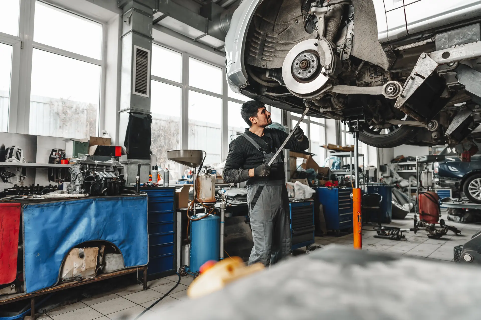 man-works-on-a-car-in-auto-repair-shop-2026-01-08-05-24-52-utc-1.webp